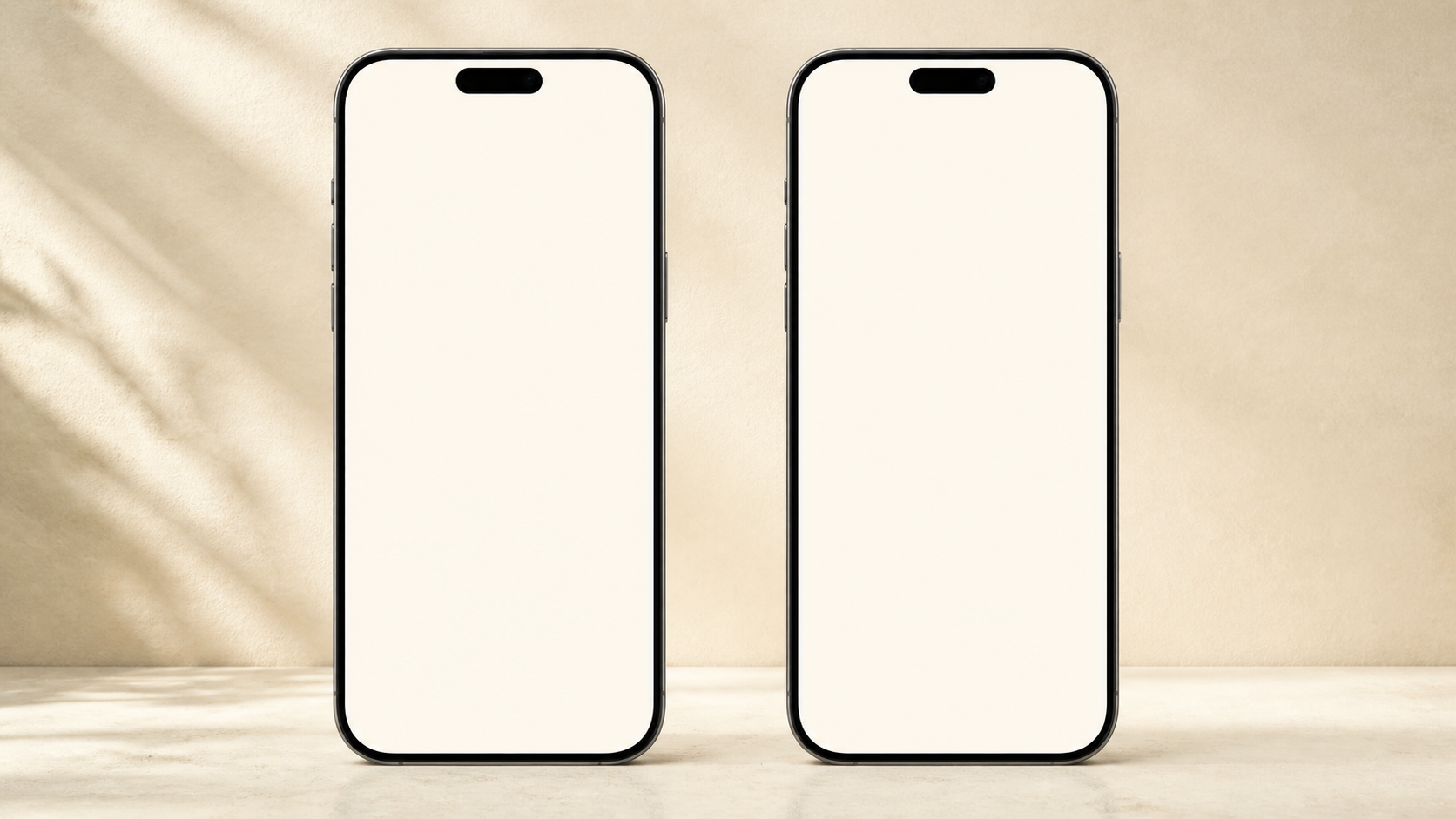 Two large mobile phones staged on a warm paper surface